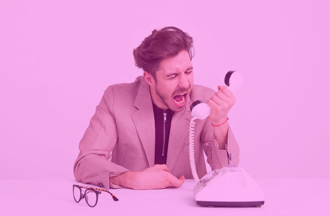 Photo-of-man-yelling-into-phone