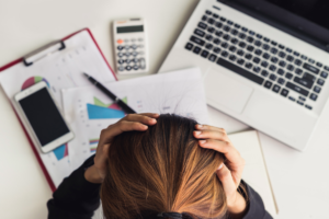 Photo of a woman stressed out because bad SEO is a lot of effort with no investment return.